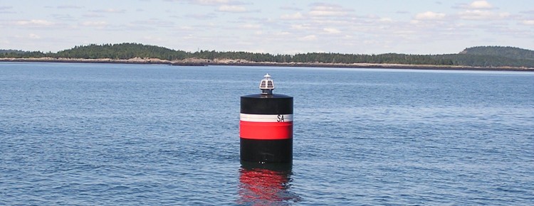 Isolated danger CAN buoy in river channel
